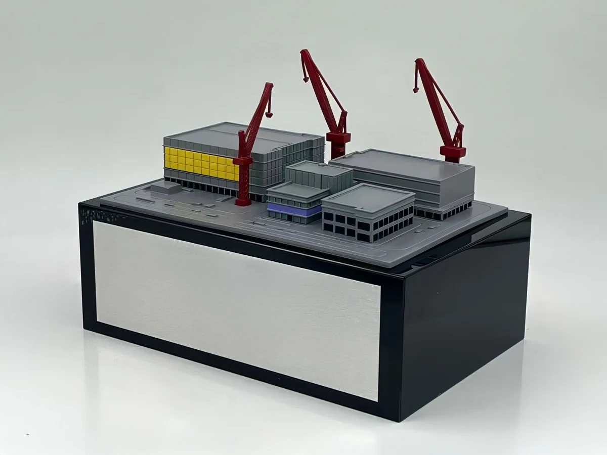 A detailed model of a data center under construction commemorates a development milestone.