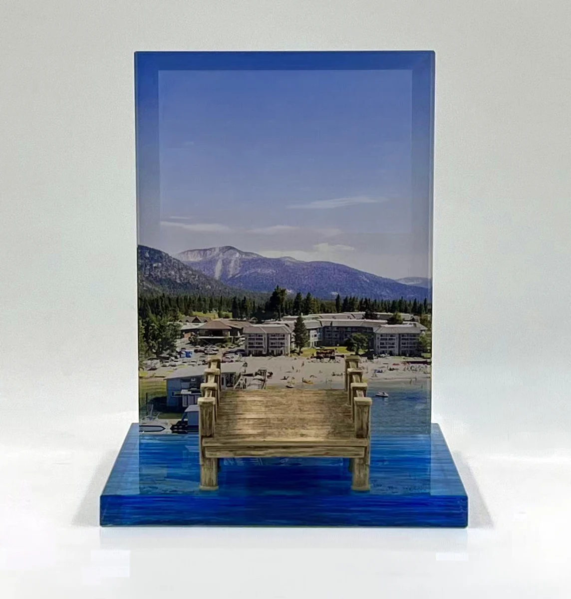 A lakeside scene and miniature pier create a distinctive keepsake.