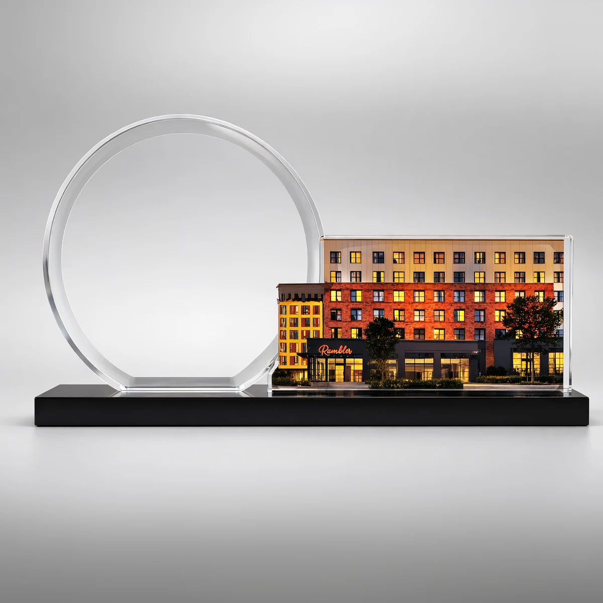 A brick apartment building silhouette paired with a circular dedication panel.