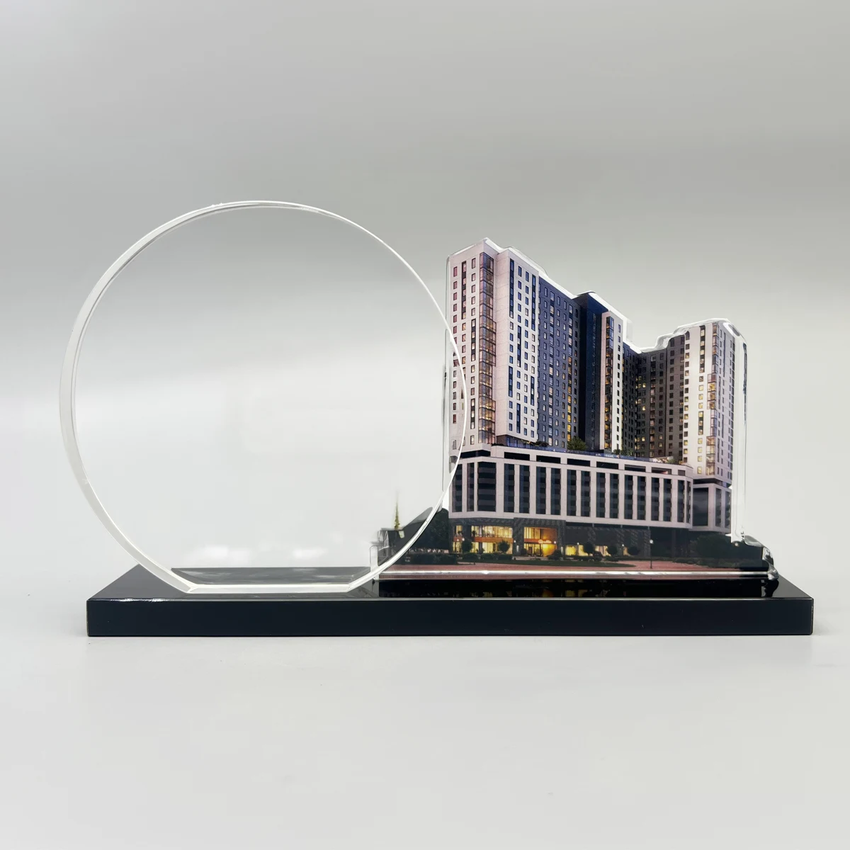 An off-campus student housing property paired with a circular dedication panel.